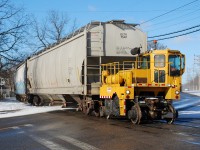 Some were wondering what hot rail action was happening on the Burford Spur these days.  Sadly it's still just the Track Mobile that typically works one day a week hauling hoppers to and from Ingenia.  I had yet to bother to get a decent shot of the current motive power so since the sun was shining and I was in the 'hood I waited a few minutes for them.  More surprising is that I wasn't the only one that had the same idea!  Here, Allied's Track Mobile is crossing Greenwich Street with three loads for the plant.  Three is probably the most it can pull, even though it's advertised to pull twelve.  Unless it's something extraordinary I promise I won't post another photo of the track mobile Steve...  