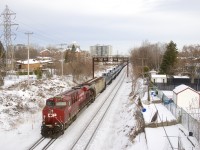 CP 8915 brings up the rear of empty ethanol train CP 651. Up front is CP 8824.