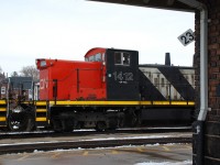 With train 331 abolished again, it seems as though 435 is now running on an earlier schedule.  It was a fairly consistent late-afternoon train working the yard in Brantford, however the past three days it has arrived around noon (which works out great for me!).  Today behind the road power was CN GMD-1us 1444 and 1412, most likely in transit to London.  CN 1412 lined up nicely with the precarious milepost 23 sign on the station wall while the conductor went in to the office to get paperwork.  The milepost sign has hung like that for decades yet it still hangs on.  