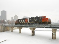 CN 7032 & CN 4129 are leaving the Port of Montreal light power on a snowy day.