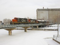 The Pointe St-Charles switcher is entering the Port of Montreal with two GP9's (CN 7250 & CN 4129) and two cars. 