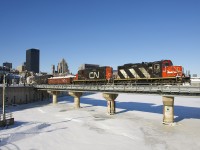 CN 4129 & CN 7250 are shoving a transfer into the Port of Montreal as they cross over the frozen Lachine Canal where it empties into the St. Lawrence River.