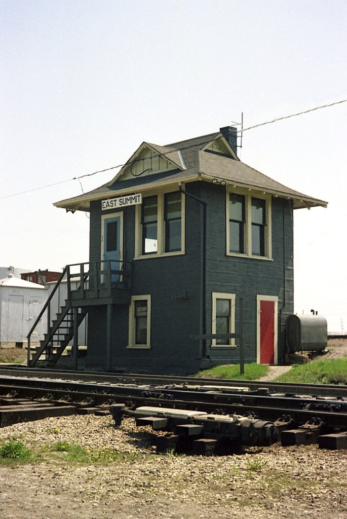 The old CN East Summit tower stood at the approach to the tunnel under the St. Clair river at Sarnia. I am under assumption the structure was removed when the tunnel was revamped in the mid-1990s. Would appreciate any information. I do know the similar tunnel on the American side, at 16th St Port Huron, closed in 1969. There is a track immediately behind this building, it's use was for high and wides to go via barge to the US due to restrictive limits of the old tunnel.