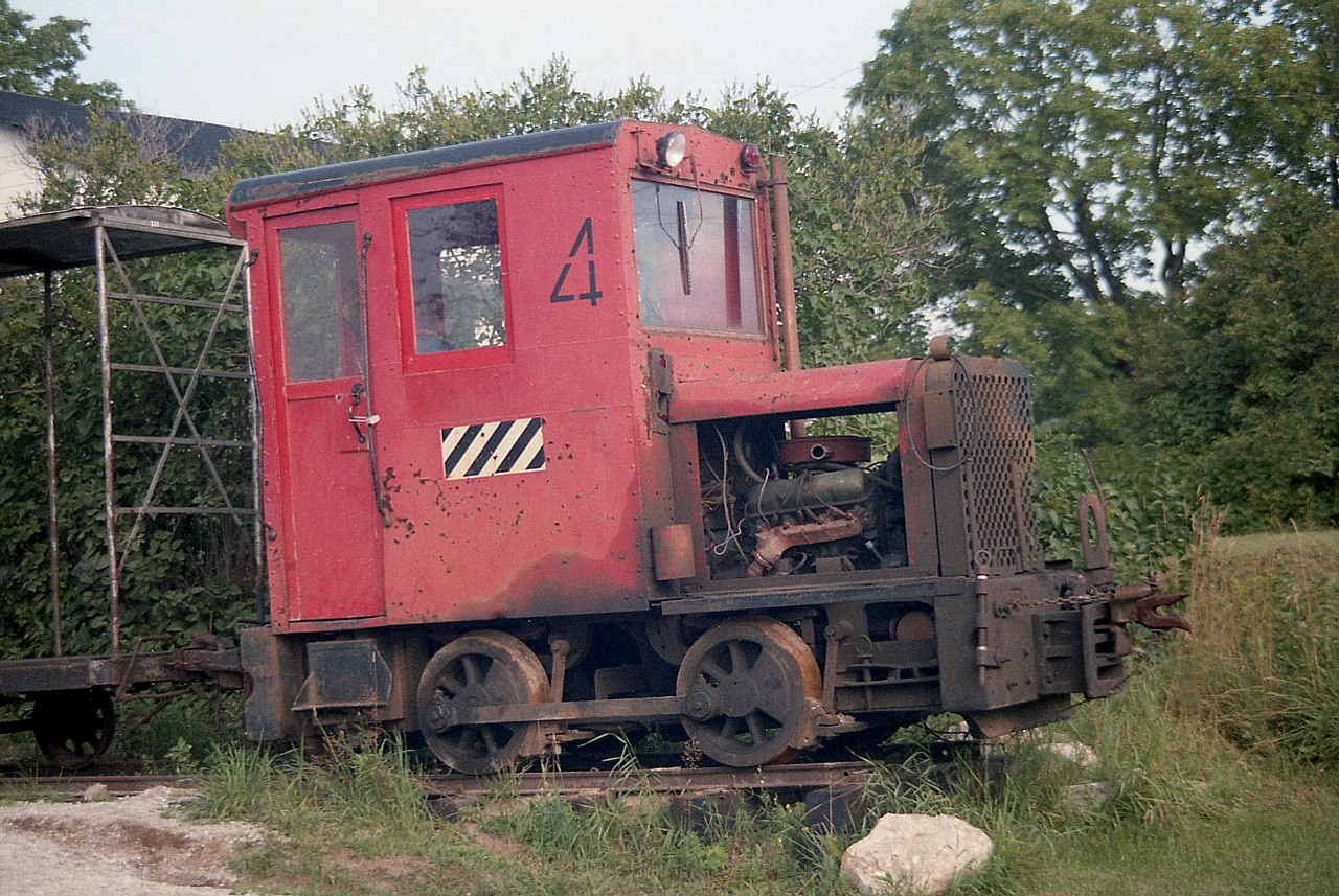 Here's a real relic from the past. Originally British Cordite #4, a 36" gauge Vulcan. Six ton. Previously was on the property of C.I.L. as their #4 in Nobel, Ont. It began life anew as part of a display of I believe 4 flat cars and one boxcar, all 36" gauge, set on rail at what was called "The Sundae Express", an ice cream and snack business next to the high school and across from the Town & Country Motel on Joseph St in Parry Sound. I recall seeing this for the first time in 1984 and a few years later most of it was gone as the business faltered. Too many winter months and not enough summer, I'd guess. I have no idea where this little gas locomotive ended up and am curious.  Anyone?
