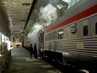 During The eastbound Canadian's stop and crew change in Field a carman discusses a steam leak with a sleeping car porter