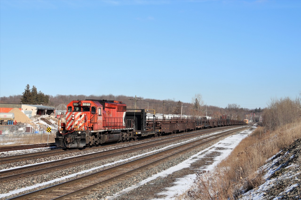 Having finished their work in the Streetsville area, the CWR train makes its way up the grade at Guelph Junction with a very nice SD40-2, CP 5922, leading the way. It would tie down in Wolverton for the night.