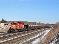 Having finished their work in the Streetsville area, the CWR train makes its way up the grade at Guelph Junction with a very nice SD40-2, CP 5922, leading the way. It would tie down in Wolverton for the night.