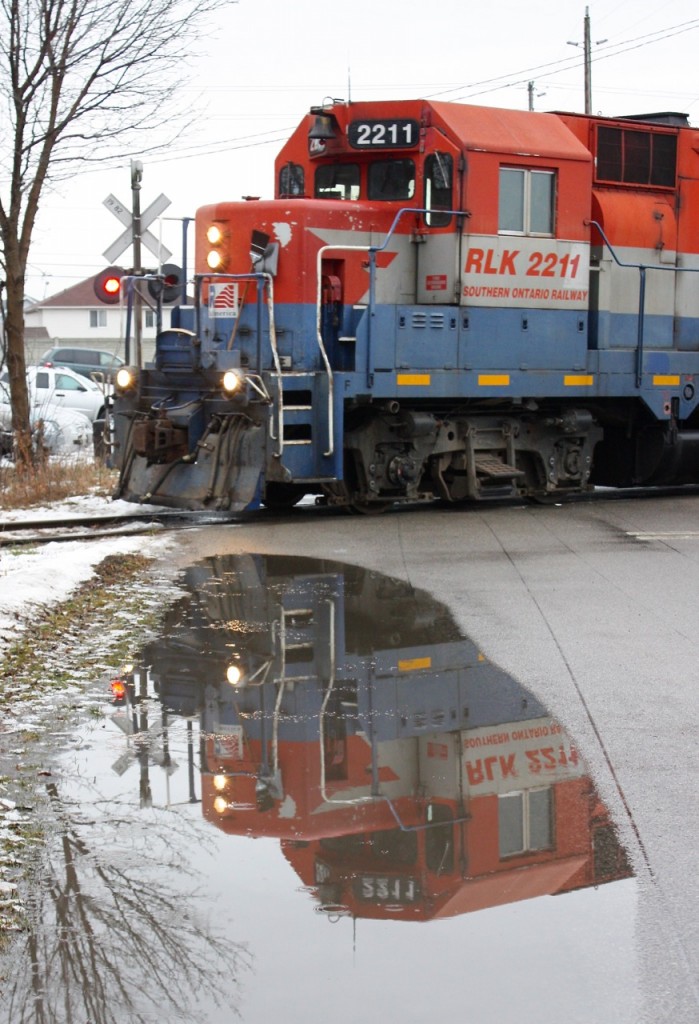 Fading reflections. Seven years has passed since I framed this image. A lot has changed, GEXR is history on the Fergus and connecting Guelph sub. and sadly the old former CPR GP35 too has fallen to a scrappers torch. Today the line is served by CN local 542 from this location in Preston, but back in 2013 GEXR served the line out of Kitchener, with weekend runs common.