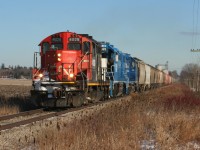 CN L568-13 with GP9RM 4028, GMTX 2323 and GMTX 2279 are just west of the town of Shakespeare, which can still be slightly seen to the left, as they head westbound on the Guelph Subdivision to Stratford. All of the cars were later set-off at Stratford for the Goderich-Exeter Railway. 