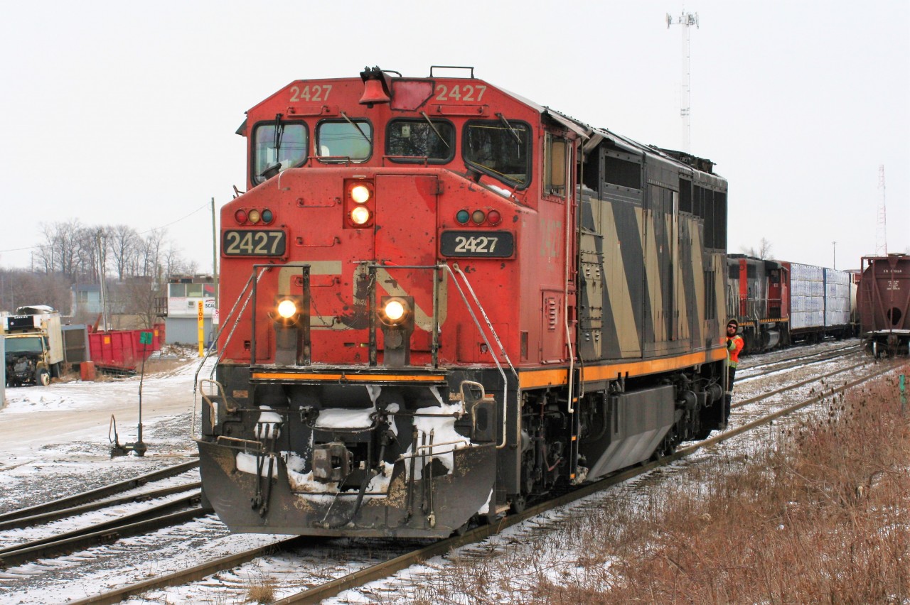 Twenty years prior, a report of a single CN Dash 8-40CM lugging 431 across the Guelph Subdivision would have set the railfan community abuzz....flash forward two decades later it actually still did. While technology, with the internet and cell phones and text messages are now able to give fans plenty of warning, the CN Dash 8-40CM's find themselves on the other end of the technological spectrum as they log their last miles facing somewhat of an uncertain future. Here, X431 has been led into Kitchener with 2427 making easy work of the Guelph Subdivision with a long train of hoppers it has just uncoupled from. 

Additional notes from the day..

During the night of February 10, 2018, CN A431 with 9675 and 9482 had a long and heavy train when it departed MacMillan yard in Toronto. Once on the Guelph Subdivision, the Niagara Escarpment grade proved too powerful for the two four-axle units. The train retreated back to (Silver) Georgetown and set-off the majority of its Stratford cars before trying another run at the grade. Eventually the units made it over and then go on to set-off 39 cars in Guelph before finally arriving in Kitchener after sunrise. The train then tied-down in Kitchener and CN would order an X431 to lift the cars left on the Halton Subdivision by A431 and bring them the remaining distance to Kitchener.