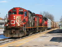 CN A431 from Toronto had set-off 1412 overnight in the yard at Kitchener. When L568's crew came on duty they were instructed to put 1412 in the middle of their consist as it had no IDU and had to be trail only. After switching the yard and building their train, L568 departed westbound to Stratford. Here it's seen passing the Kitchener station with 4130, 1412 and 4761. After CN's return to the Guelph Subdivision in November 2018, the proceeding winter gave area photographers some really retro consists and this was certainly one of them. 
