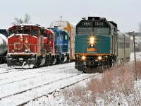 VIA Rail #85 with 6441 passes Mile 62 on the Guelph Subdivision as CN L568 builds its train for the Huron Park Spur at the Kitchener yard with 9675, 7080 and GMTX 2289. 