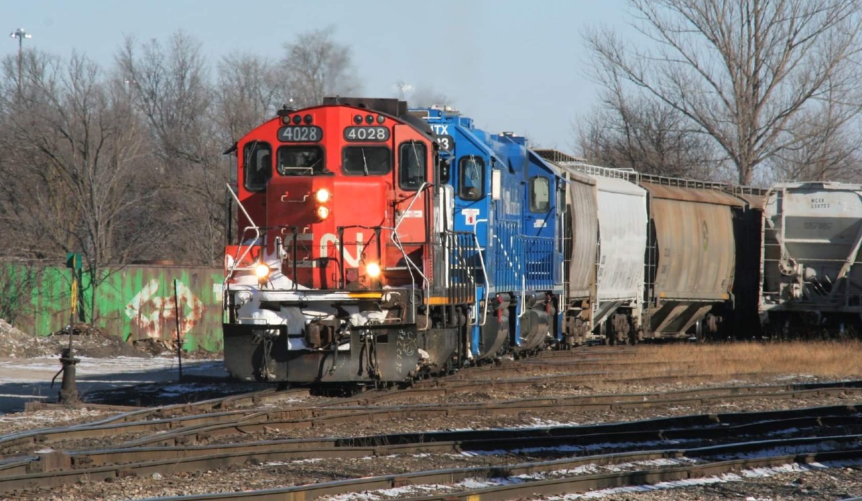CN train L568 with GP9RM 4028, GMTX 2323 and GMTX 2279 are building their train in the Kitchener yard. All of the cars were later set-off at Stratford for the Goderich-Exeter Railway.