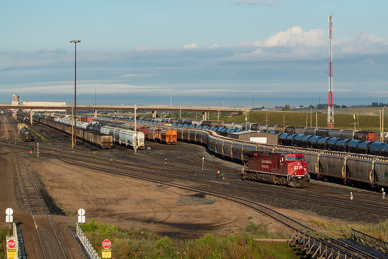 Views of Moose Jaw Yard. This was the first train of the day - 852 had just rolled into town (coal loads pictured) and the head end unit headed for the shops (which I photographed later that night, here). Next, I went to the overpass pictured to the west where I shot 118 coming into town. In the distance you can see the Viterra terminal, where later that morning I encountered K39 pulling loads out to the main. Further east of this location are other interesting views, such as where Southern Rails Cooperative passes above the yard to access the CN interchange.