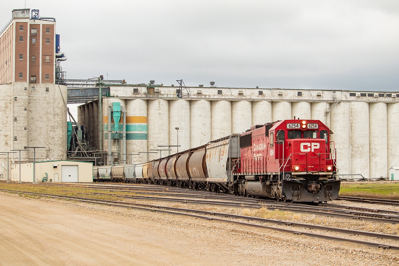 On the west end of Moose Jaw, visible in this shot of the west end of the yard, is the Viterra terminal. On this morning, K39 with the 6254 solo, lifted about 70 or so loads. They did this in two trips - in the first trip they lifted about 40+ hoppers and took them into the yard, and in the second visit to Viterra they pulled 30 cars out. They did the second batch in two trips, setting the first set of loads on the north track of the main before going back to get the rest and then doubling up on the main to head back to the yard. It's a decent grade from Viterra up to the main and they put on a good show in the process.