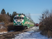 The single track section on the CN Grimsby Sub between Jordan and Nelles Road is a mere 10 miles, so overtaking occurrences here really are quite rare. The waiting CN 331 most certainly had enough time to stay ahead of the noon hour GO train from Niagara Falls, so my guess is this had something to do with congestion around Hamilton.
<br><br>
The weekend GO trains to Niagara Falls are permanent year round now. While their stay is mostly certain, CN 331's stay was always in question, as was its counterpart 330. Since 2008, they have now been cancelled three times. Unless CN creates a different plan with the new container traffic, 330/331 will likely be back again when the MacMillan Yard hump gets busy again.
<br><br>
The rare Jordan overtake will be even harder to accomplish with 331 gone, though this does open up more of a possibility that it will occur in better evening light come spring. Extra westbounds such as X422 have a much higher tendency to run in the late afternoon, which may allow a meet with the Toronto bound Amtrak Maple Leaf or second last GO train on weekends. While I've heard of it happening twice, this is the first Jordan overtake I've seen railfanning in Niagara over my 12 years here. It was a welcome surprise when ATCS indicated that an overtake was certain to happen in the last block before Jordan, and sure enough, 331 had already rolled up to the signals minutes before GO arrived. Occurrences like this were fairly common when Jordan was a crew change point, but with trains starting and terminating at Port Robinson now rather than Buffalo, that rarely if ever happens anymore.