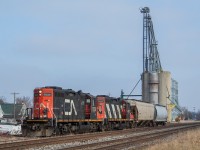 After <a href="http://www.railpictures.ca/?attachment_id=39938" target="_blank">lifting two empties out of Agris</a>, 514 pulled them east across Victoria Road (County Road 21). They're now pictured here on the east side of Victoria Road after having run around the two empties, and are nearly ready to depart west for Chatham. Fortunately, after a mostly overcast beginning to the day, the sun was doing its best at this point to fight through the clouds.