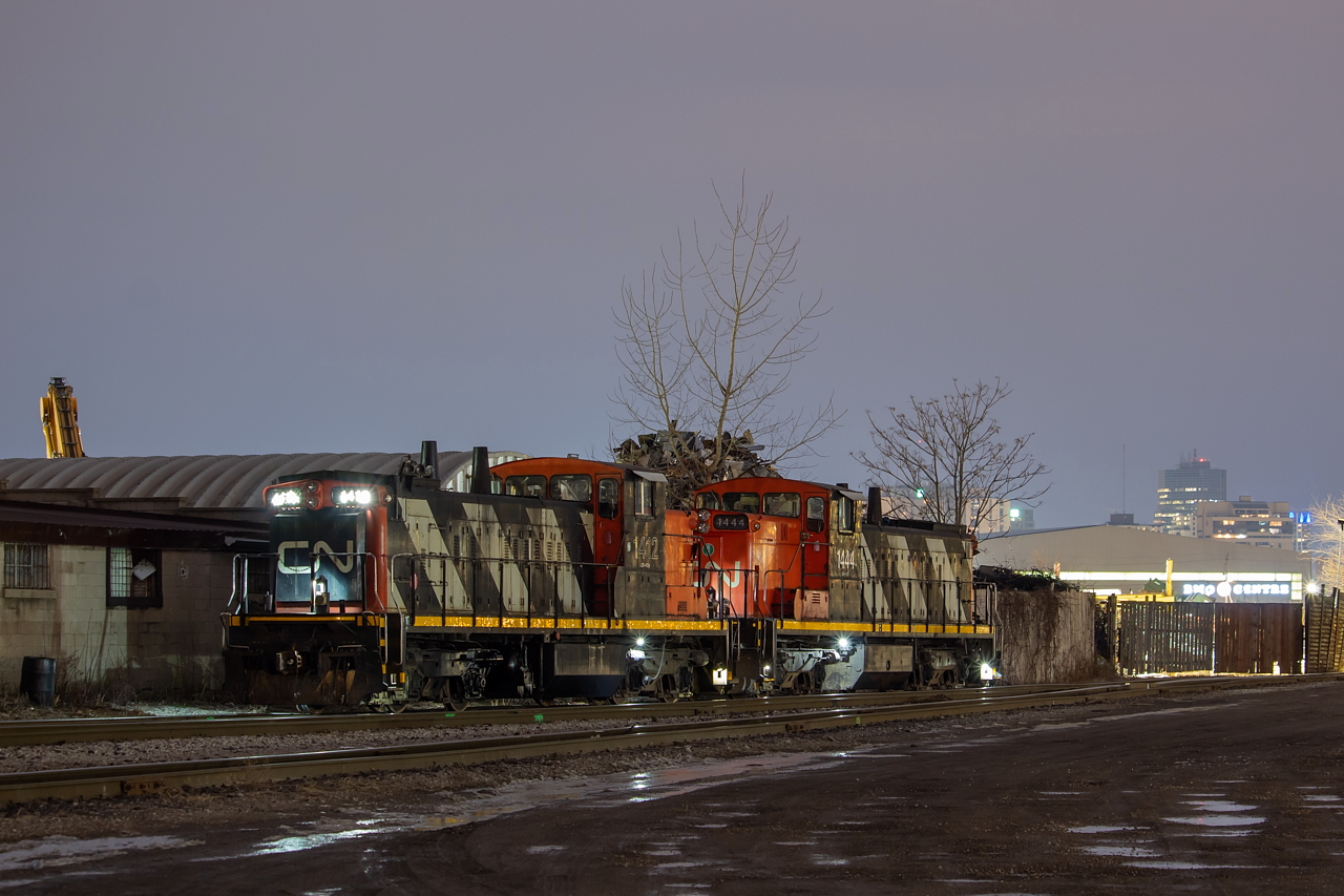 A couple of old workhorses idle away at London East, sitting next to Zubick's scrap yard. In the background, the BMO Centre provides a familiar site for those familiar with railfanning around London. This was shot in the early evening hours, and once 435 yarded their train, 583 was not far behind it. When 583 made their set off, their power was tied onto the two GMD-1s for the evening's 584 to St. Thomas and back. The full complement of 584 power for this evening was GMTX 2695, CN 4774, CN 1444, and CN 1412.