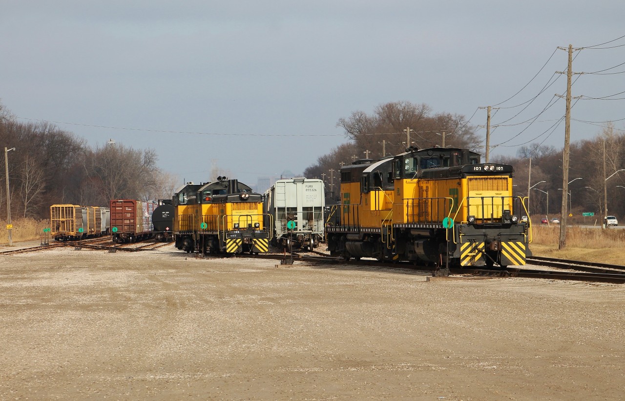 It's not uncommon for both ETR jobs to be working either end of Ojibway Yard at the same time. It is uncommon though to be able to shoot all 4 of ETR's units at once without getting access to their engine shed. Normally, one job has two units and the other has 1 while the 4th stays back at the shops in a rotation. For some reason this day ETR had their entire roster out to serve their customers. The 0900 job was 107 and 108 (right), and the 0700 was 105 and 104. The 0900 crew was on lunch break and the 0700 job was organizing storage cars in this scene.