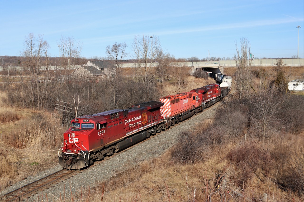 I was in Burlington when I got a nice tip from a friend that CP 8008 was leading CP 246 so over to Newman Road I went. A few minutes later I got another saying an SD40-2 was along for the ride. Well, in perfect sunshine for a change, out from under the Highway six bridge comes CP 8008 with CP 6051 and CP 8131 heading down the Hamilton sub on their way for work at Kinnear Yard.
