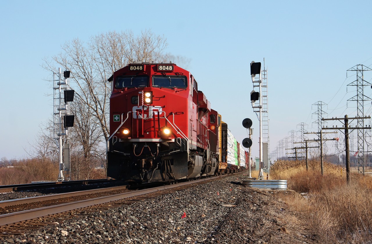 I was a little too late in getting a shot of a train at begin/end CTC signal 104.5 before the inevitable occurred. I took the signals here a bit for granted and was waiting for a good leader in good light before bothering to shoot a train with the 1960s era searchlights here. That mentality backfired on me as CP put up replacement LED Safetran "vaders" up at the location a couple of weeks ago. They haven't cut the signals over yet, but unfortunately the older searchlight signals here are not long for the world. So today when I heard 235 was running a bit later than usual it was a no brainer for me to shoot them here so that I at least have a shot at this location before the searchlights are removed.