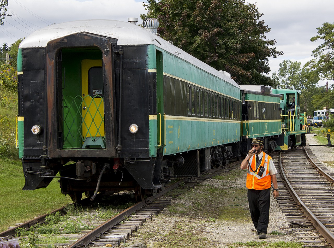 Our first time on the PSTR was very memorable. Only cause this day was the last train for the day that we were going to ride on. Its also a very popular line with rail enthusiasts from all over. This was evident by the other photographers and videographers alike (that were just out of frame). Here, the previous train was returning from it's run up to Whyte's. A couple of familiar faces to the rail community were working this day...including the conductor who was in communication with the engineer working the throttle to ease into the siding.
