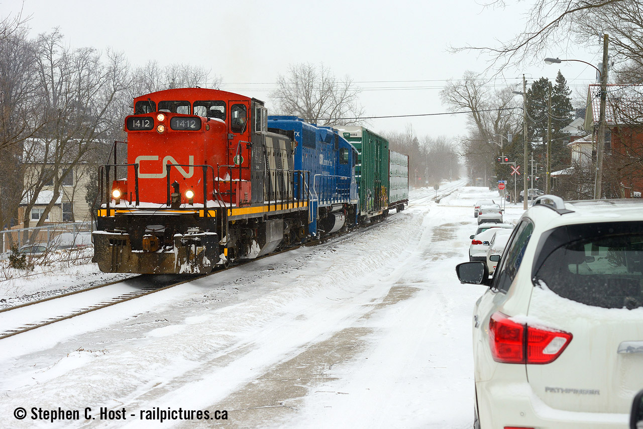 Three GMD1's visited the Guelph sub not long after taking over from GEXR and this one only led once - according to Jason Noe it was an IDU issue that had 1412 relegated to the middle most of the time. I've since shot 1412 in Hamilton leading on the N&NW spur but it's yard track down there not the mainline.   Seen here at Kent St passing the "street running" -  Metrolinx has since fenced everything off in this photo.