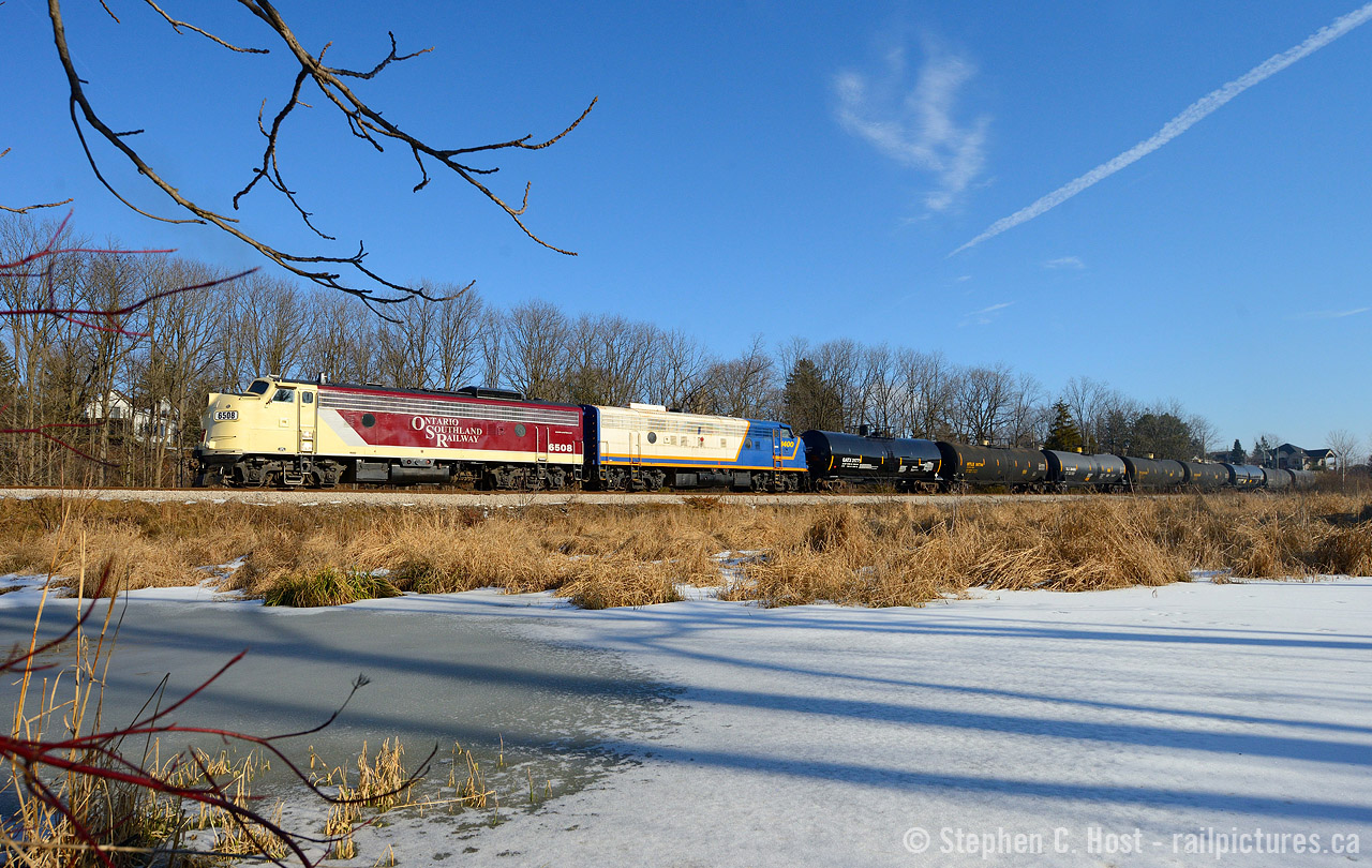 OSR doesn't seem to run too often on weekends to Woodstock these days, when I heard they were running on a sunny weekend day I bee-lined it over - been a long time since I've been able to. The boys are almost done for the day and are shoving with 10 tank cars for Salford - the tanks were lifted from Ingersoll to go south to Tillsonburg the next day. The boys were off duty by 2:30 PM. Photo location is at the Ingersoll Golf and Country Club.