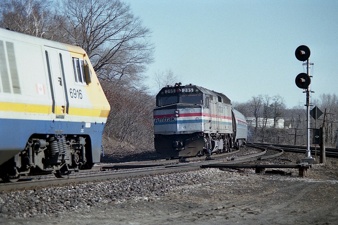 The Amtrak 295 #81 (International) is westbound about to pass the VIA 6916 #70 at Bayview Junction in the morning around the 0900 hour.