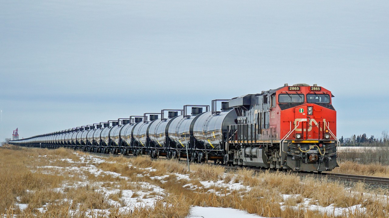 A train of brand new oil tanks, no placards and shinny clean, approaches Lamont on CN's Vegreville subdivision.