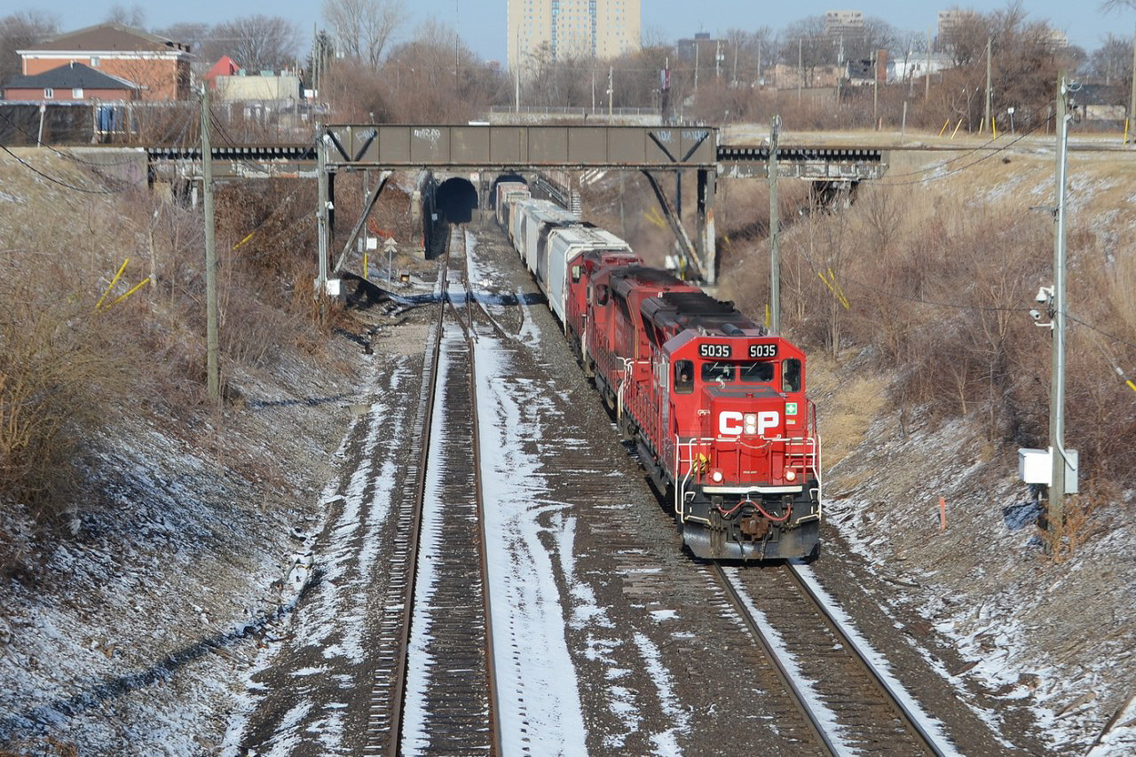 CP local train T28, comes out of the tunnel, just before CP trains 140, after taking a short train back to Canada, from the NS in Detroit.