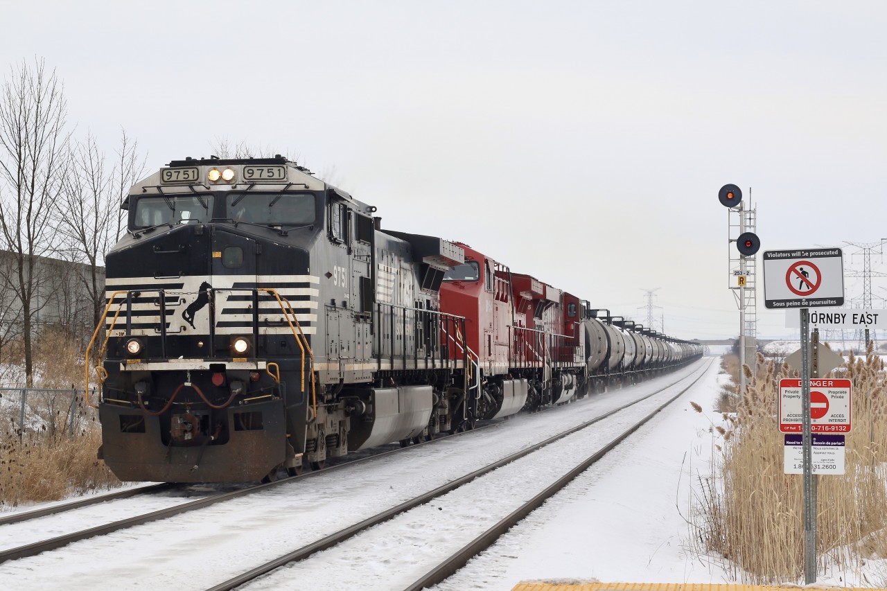 This is the first time that I have seen Hornby yard switched out in the daytime. The NS leader and CP power ran light from Wolverton after dropping #244's train then worked Hornby yard in the distance at the far signal for about an hour, then headed Toronto bound with 33 tank cars.