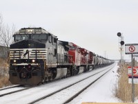 This is the first time that I have seen Hornby yard switched out in the daytime. The NS leader and CP power ran light from Wolverton after dropping #244's train then worked Hornby yard in the distance at the far signal for about an hour, then headed Toronto bound with 33 tank cars. 