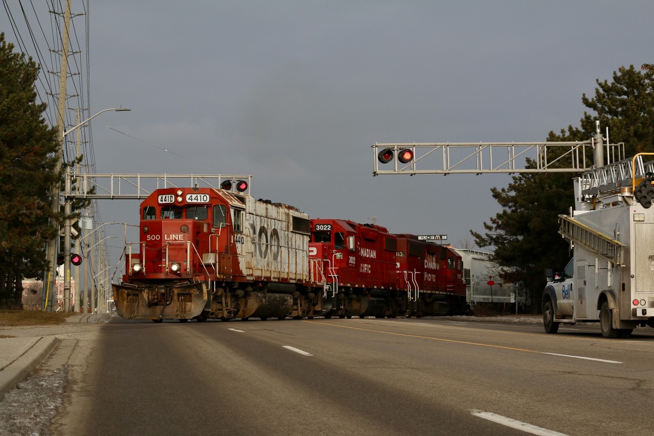Other then motive power traveling to and from the OBRY this is the only time I have ever caught three units on T14 in all of my years of photographing the train. Reportedly 3022 had mechanical issues yesterday, and I couldn't think of a better unit to fill in for the occasion. With only a few painted SOO units left on CP's roster this was certainly a good reason to get out of bed early. These days T14 is often in Streetsville around 6am rather than late morning. While most of the former SOO GP38's are now equipped for remote control operation, it appears 4410 so far has not been RC equipped. The train has now finished switching in town and has just grabbed a cut of BNSF covered hopper left on the branch, that were lifted earlier on its way to Streetsville and will depart town as soon as train #651 passes.