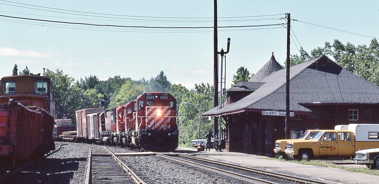 ….Clear Board....and one of my favourite places...


...a quartet of six motor units: 6049 / 5513 / 5531 / 4566 rolls into Parry Sound preparing to spot the Van at the station to entrain personnel


  SD40-2  /  SD40  /  SD40  /  M630


 CP Rail #405 at Parry Sound 11:35 August 11 1985 Kodachrome by S. Danko
 

  what's interesting


  always something going on at Parry Sound, whether it's daily VIA #9 & #10 ; a work train - witness the work train Van - and /or the signal / maintenance crew activity


  note the front end of  ' Parisienne Atlantica ' on the extreme right, of Newfoundland road trip fame...


  recommend camping at  nearby Oastler Lake Provincial Park, literally steps away from the CN and CP mains. Real treat overnight.....heard  of many campers abandoning their long weekend campsites Saturday mornings...'too many trains'....HA!


 more Parry Sound


  anticipation at the station   
 

sdfourty