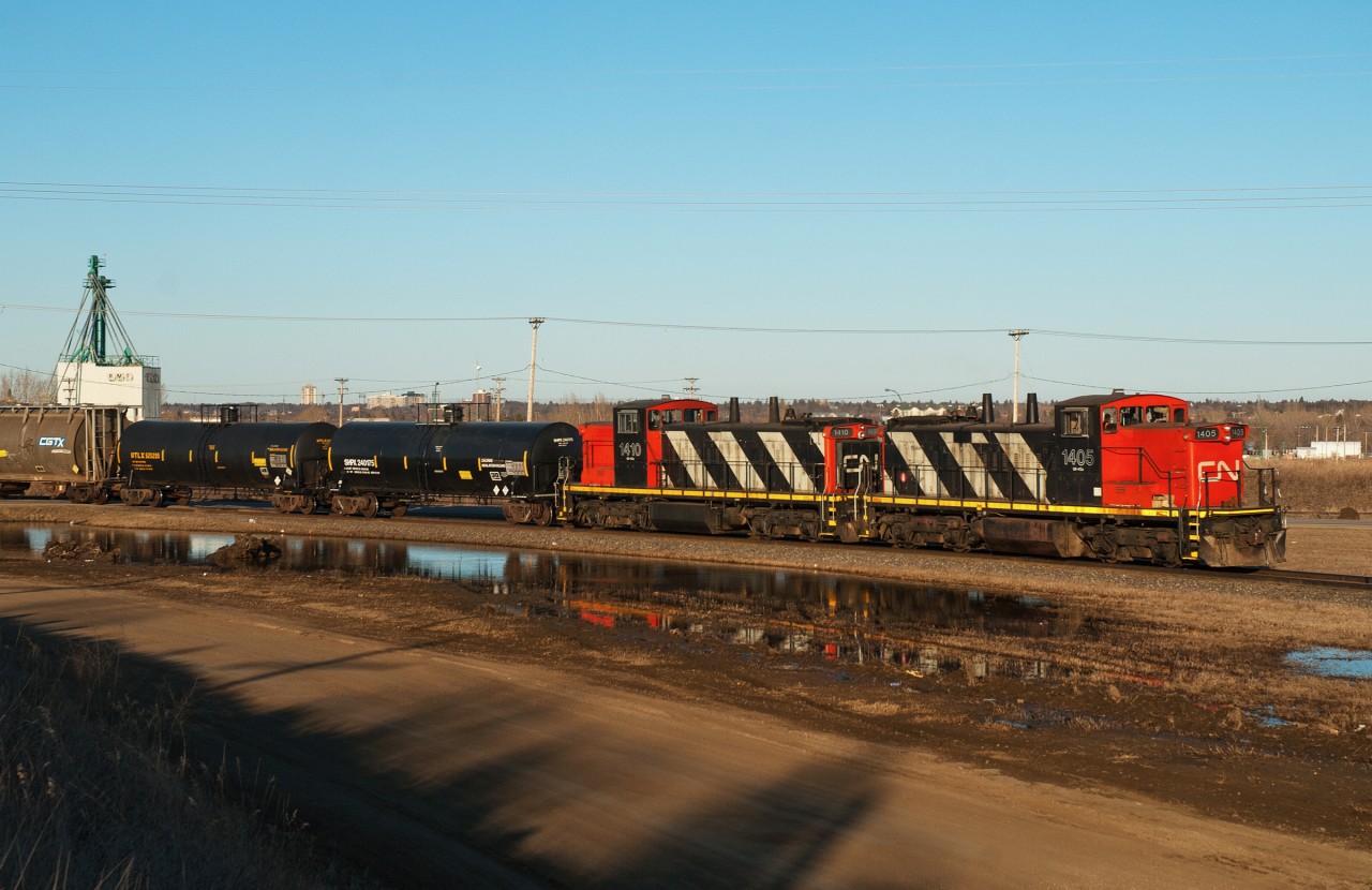 A yard job makes its way off the Warman Sub and into Saskatoon yard proper with a decent looking set of GMD-1s. To the best of my knowledge 1405 is still on the active roster today (2020), while trailing unit 1410 was sold off to NPR.