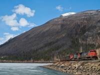 CN coal empties navigate around Moose Lake and are about to duck under Highway 16 as they make their way east towards Jasper for a crew change. 
