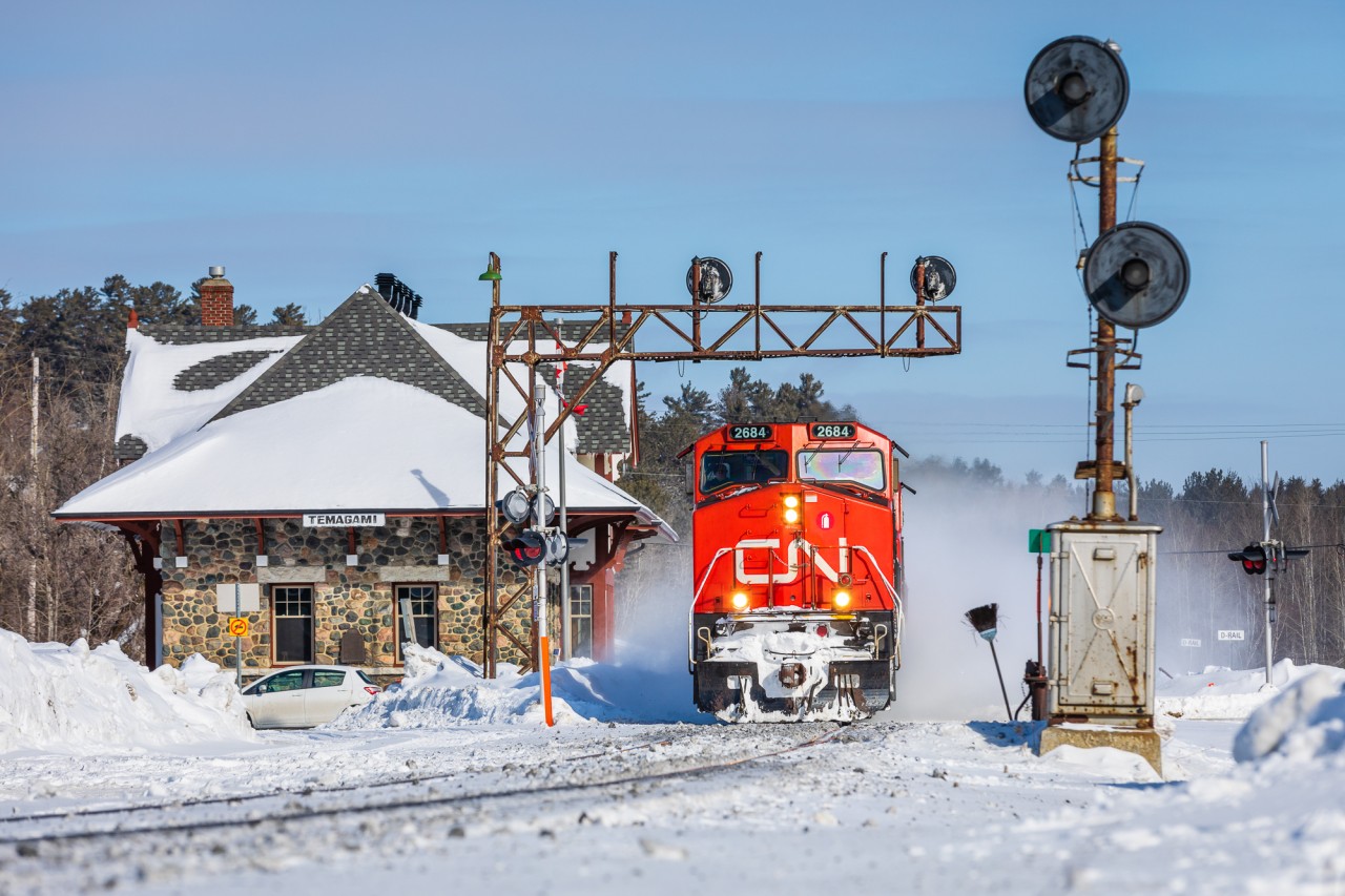 On the ninth day of the Wet'suwet'en First Nation rail blockade in Ontario - a day after CN announced it would "shut down its Eastern Canada network" - a handful of trains took the scenic route over the Ontario Northland Railway to reach their respective destinations of Toronto (southbound) and Northern Quebec (northbound). Here, detoured CN stack train no. 149 is seen racing southbound along ONR's Temagami Subdivision, kicking up snow by line's gorgeous namesake station.