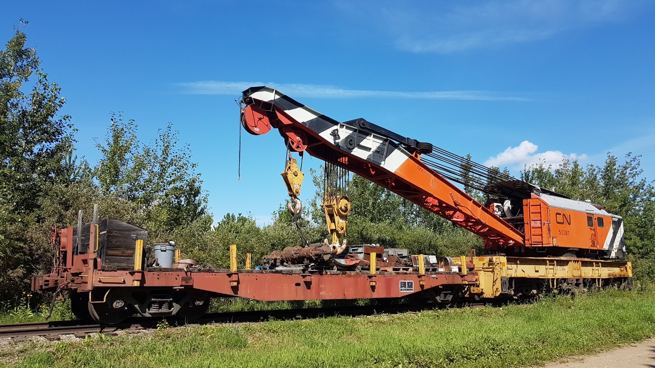 This photo was taken when the crane and the idler flatcar were parked along the access road. This piece of equipment is used by the museum staff moving large equipment when the need arises.