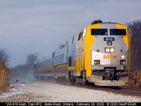 SUCKER!!!!!  VIA 910 is about to cross the Stuart Lane crossing just east of Belle River, Ontario this morning as the smallest of sucker holes opens up to light up the locomotive of train #72.  Better to be lucky than good I guess.....   :-)