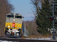 <b>Uphill Struggle</b> With 12,000 tons on the drawbar, this SD70ACu is in full voice climbing Campbellville Hill straining to keep it's tonnage from stalling.