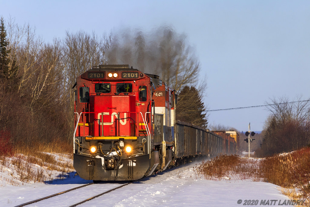 A pair of C40s, CN 2101 and BCOL 4609 are in charge of a small, 30 car train 406, as they head through Apohaqui, New Brunswick. I don't really shoot 406 much anymore, as the power can be pretty boring to shoot. When I found out this power combo was coming down, I had to make an exception, just this time.