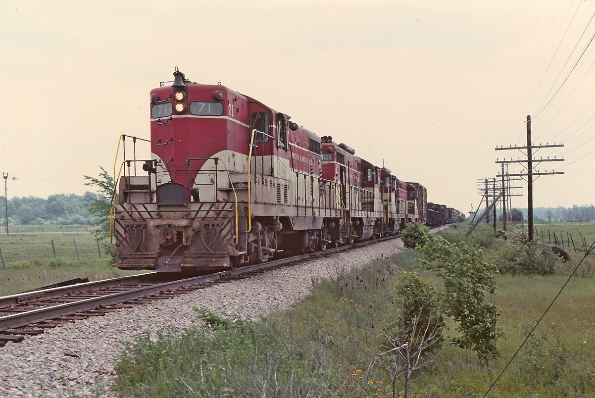 A great photo from Ron Tuff. Ron has this labelled "Montrose Job" which has me wondering if this was the joint CP-TH&B-PC symbol FT-1 TF-2. The train, in my opinion appears to be travelling west and Ron notes it at Summit. In the older TH&B time table I have there is no Summit on the Welland sub and I'm wondering if it is at or near Vinemount which I recall was the top of the grade. All in all, it is a great scene from long ago.  Thanks Ron for the image.