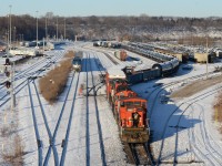 Driving up the hill toward Stuart Street seeing the GMD1 in lead working Hamilton was something you need to stop for even with the -20 degree lake winds just completely taking over your body. They headed to the west end of the yard to spot some tank cars on a cut that needed to be lifted, came back to the east end here at Stuart street then headed back into the yard. 10 minutes passed and they still don’t pull up to a point where it’s shootable and was making me confused as I didn’t want to wait in this cold much longer as I couldn’t feel my upper body. Just then they pull a cut of cars out of the yard and start to proceed to the main track for headroom when VIA 97 the VIA operated inner Canada Amtrak train flies around the corner pacing this yard job’s train as it pulls out. Will they be side by side? No, unfortunately 1437’s nose ducked under the bridge before the Maple Leaf got closer into the main frame of the shot but what do ya do. Still a cool scene to see Canada only operated GMD1’s with Amtrak equipment in the background. With the perfect sun light to, the last thing I’d do is complain.