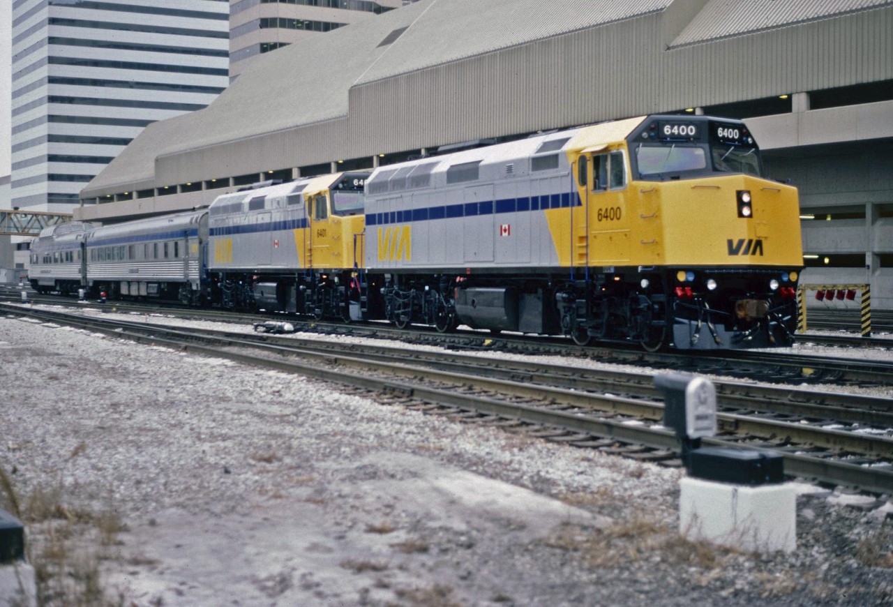 It's hard to believe how the time has gone, but over 34 years ago, the F40PH was introduced to the public and press at Toronto Union Station.  In sparkling fresh paint, VIA 6400 and 6401, recently out of the GMD production plant in London, make there way into Union Station for the official unveiling. Behind the two units are a diner and Park Car which will be used to entertain invited guests.