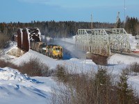 The Hearst to Cochrane triweekly train makes its way across the Groundhog River west of Fauquier.  514 departed Hearst shortly after 0600 with 22 cars and subsequently lifted an additional 16 in Kapuskasing before continuing eastwards.  It's a fun chase as the train is limited to around 30km/hr and there are many interesting bridges and small towns that the railway passes through.  As seen beside the railway, Highway 11 also passes over the Groundhog River via a two-span steel truss bridge and work is well under way to replace this aging 80 year old structure.  The piers and headers of the new bridge can been seen on the far right.