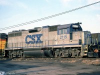 CSXT / B&O GP38 4140 sports one of the early versions of CSX's paint scheme, seen at St. Thomas in October 1987. This "CSX stripe scheme" livery featured only grey and blue paint, and debuted in the mid-80's. Yellow ends would soon be added to later repaints. Note that this unit, originally built at B&O 4815, is stenciled for both B&O and CSXT on the cab.