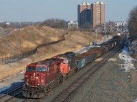 A CN detour train on Metrolinx owned track with a CP leader, this is what it's all about. CN has detoured a few trains over the CPR to get some standing traffic moving and as we see one slogging up the hill on the Weston Subdivision with 7,100 ft of train.
