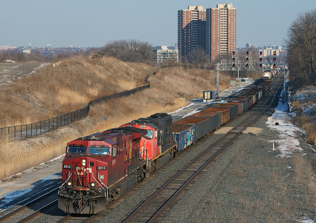 A CN detour train on Metrolinx owned track with a CP leader, this is what it's all about. CN has detoured a few trains over the CPR to get some standing traffic moving and as we see one slogging up the hill on the Weston Subdivision with 7,100 ft of train.