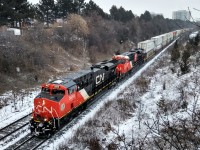 CN 3859 and 3894 lead a Westbound inter-modal en-route to the Brampton Inter-modal Terminal as the city of Vaughan experiences a light dusting of flurries.